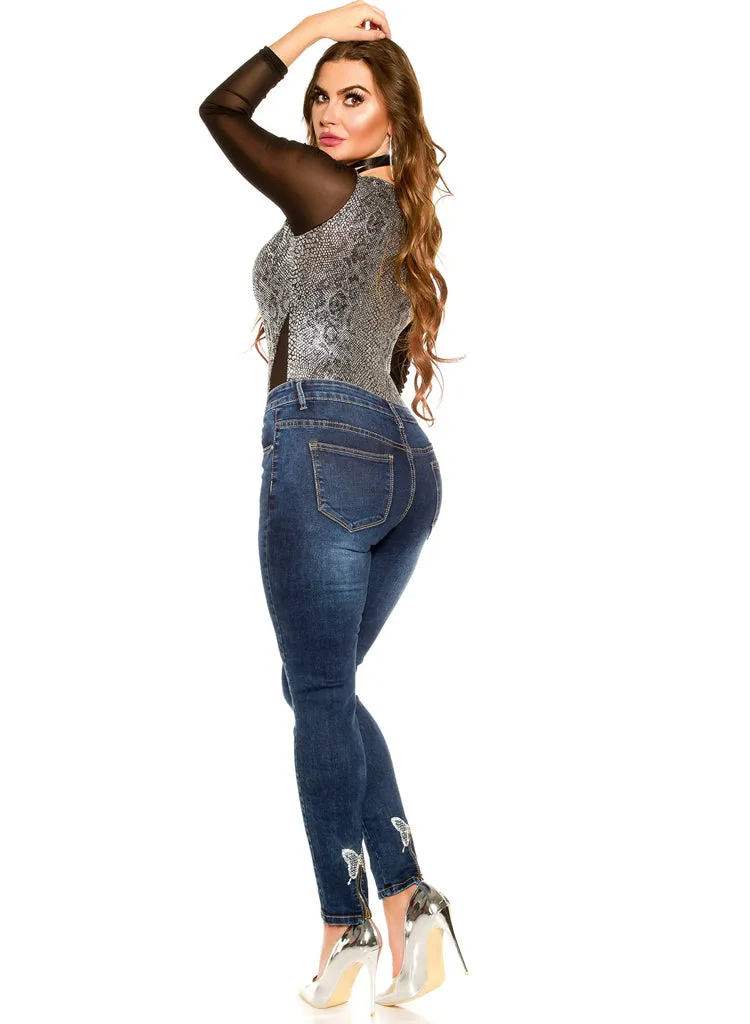 Sexy Curvy Girl Plus size jeans with Silver butterfly and zip decorations.